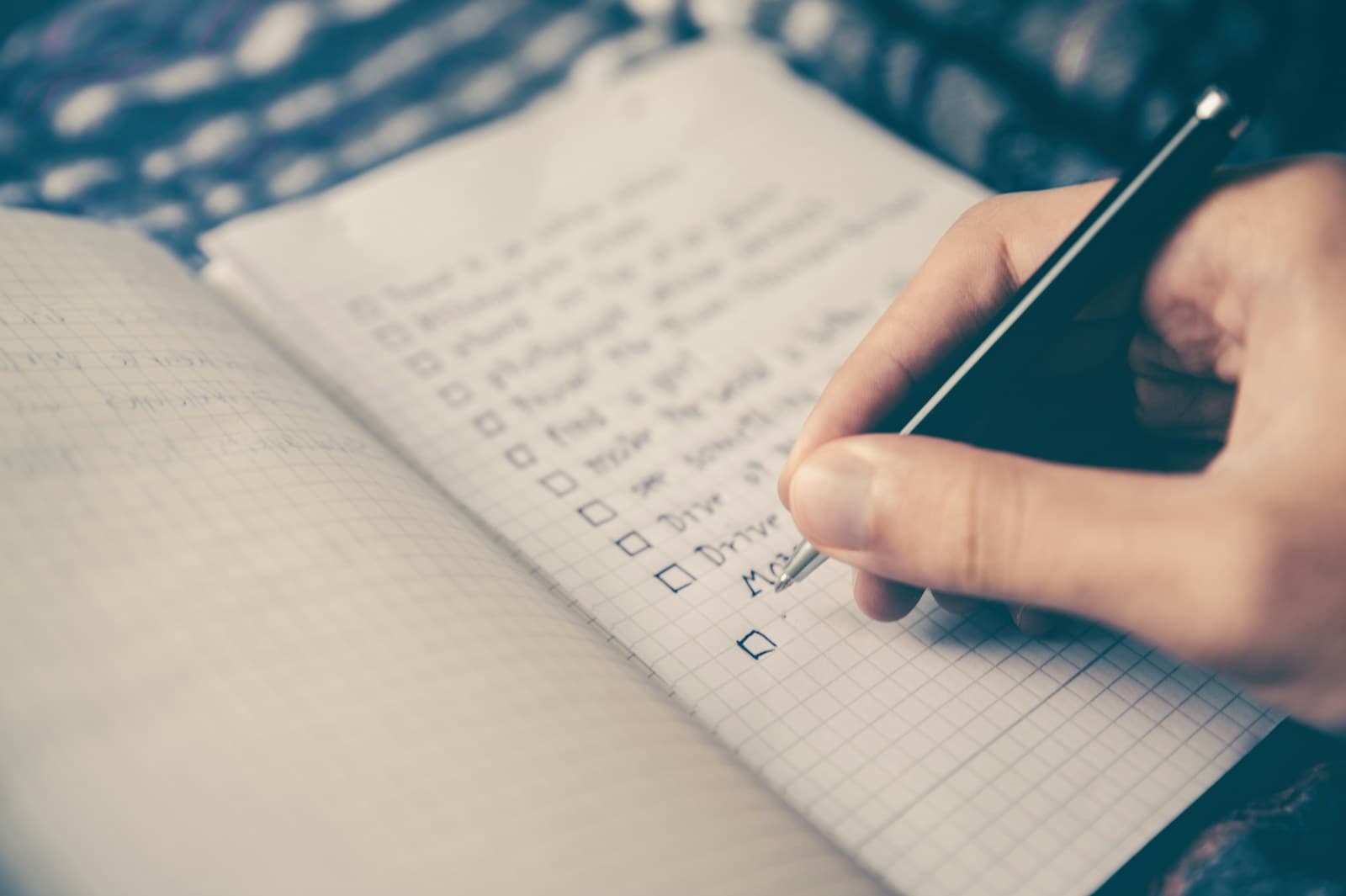 A person working through a written planning checklist